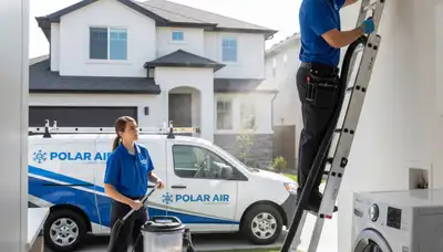Technician cleaning dryer vent for home safety in Dayton, OH – Five Star Cooling professional service